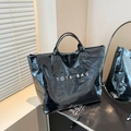 Black crocodile embossed patent leather tote bag with white TOTE BAG lettering detail - Black