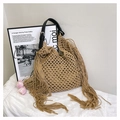Detail of hand-woven tote bag featuring khaki mesh grid design and long side tassels - Khaki