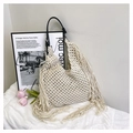 Detail of hand-woven off-white macrame tote bag featuring leather strap and long fringe - Off-white