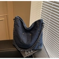 Detail of dark blue denim tote bag with metal rivets and chain woven handle strap - Dark Blue