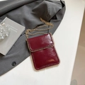 Elegant wine red glossy mobile phone bag with golden chain trim and shoulder strap - Red