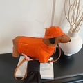 Creative dachshund-shaped shoulder bag in vibrant orange and coffee brown finish - Orange