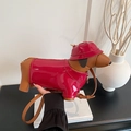 Creative dachshund crossbody bag in brown leather with shiny red coat and sun hat - Red