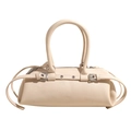 Minimalist cream white barrel baguette bag with metallic buckle straps and top handle - Off White