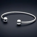 Minimalistische roestvrijstalen open armband met twee gepolijste metalen bollen zilver - Kogel Open Armring / Staalkleur