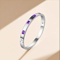 Close-up of a silver stainless steel bangle with inlaid rectangular purple gemstones - Silver (Red Rhinestone)