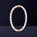 Bamboo style bracelet with gold accents and white resin segments for a unique minimalist look - White
