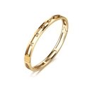 Close-up of golden hollow double-rail bangle with five sparkling inlaid cubic zirconia - Gold Hollow Rhinestone Bangle