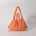 Quilted puffer tote bag in vibrant bright orange color with puffy top handles and drawstring - Orange