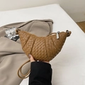 Handcrafted brown woven crescent bag with leather texture and thin shoulder strap - Brown