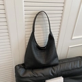 Large black woven leather hobo bag with wide shoulder strap and spacious interior design - Black