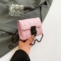 Pink quilted mini chain crossbody bag made of textured leather with a vintage metal lock - Pink