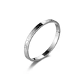 Detailed close-up of a silver stainless steel bracelet featuring Greek key patterns - Steel
