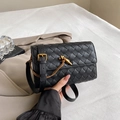 Handwoven black leather crossbody bag with brown cord and golden metal lock closure - Black