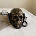 Gothic skull crossbody bag in vintage gold finish with black crocodile texture strap - Bronze