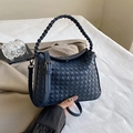 Handwoven navy blue leather crossbody bag featuring intricate Intrecciato texture - Blue