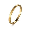 Detailed macro view of golden stainless steel bracelet with geometric triangle texture - Gold (33-C-6)