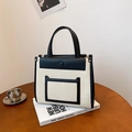 Bolso tote minimalista de lona blanco crema con ribete de cuero negro - Negro