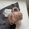 Pink plush faux fur Boston bag with smooth leather handles and adjustable shoulder strap - Pink