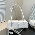 White minimalist baguette shoulder bag with leather texture and heart bow charm - White