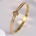 Macro shot of gold-plated clover bracelet with pink enamel inlay and radial floral texture - Pink Clover Bangle (40甲-B-9) / Pink
