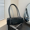 Minimalist black baguette bag in matte leather featuring a stylish bow and silver chain - Black