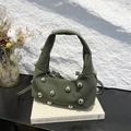 Olive green hobo bag with large silver metal beads on a book with dried flowers - Green