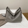 Dark grey leather tote bag with pebble texture and adjustable silver metal buckle detail - Gray