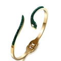Detail of golden snake bangle featuring green pave stones and an easy-open hinge clasp - Green
