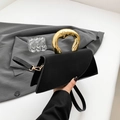 Elegant black geometric handbag with unique liquid-effect gold metal handle and strap - Black