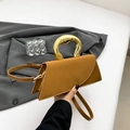 Minimalist camel trapezoid handbag with sculptural gold metal handle and shoulder strap - Brown