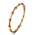 Bracelet jonc style bambou doré avec pierres rouges et fermoir de sécurité - Style Bambou Zirconium Rouge (39-A-11)