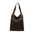 Deep brown tote bag featuring a large capacity and stitched grid pattern for daily commute - Brown