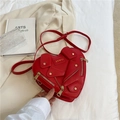 Red heart-shaped biker jacket crossbody bag with golden zippers and leather details - Red