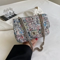 Bunte Graffiti-Schultertasche mit Pailletten und silbernem Metall-Drehverschluss - Silber