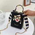 Black box bag with cartoon graffiti, pearl earrings detail and silk scarf handle - Black