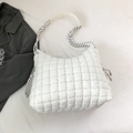 Quilted white puffer shoulder bag featuring unique black and white braided rope straps - White