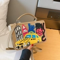 Khaki New York themed crossbody bag featuring NYC taxi and skyscraper embroidery - Khaki