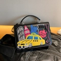 Black leather handbag with NYC city embroidery and colorful taxi patch detailing - Black