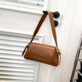 Brown vintage style leather underarm bag with minimalist flap design and shoulder strap - Brown