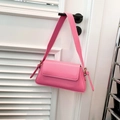 Fashionable bright pink faux leather baguette shoulder bag with golden metallic rings - Pink
