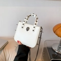 White Gothic punk handbag with metal skull decor, silver studs, and a chain strap - Skeleton White