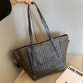 Dark gray woven leather tote bag with sturdy double handles and golden metal hardware - Gray