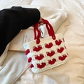 Handmade crochet mini bag with red heart patterns and matching red handles - Red