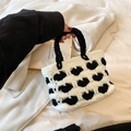 Handmade crochet tote bag with black and white heart pattern and woven handle - Black