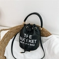 Chic black drawstring bucket bag with litchi texture and gold metal hardware - Black
