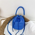 Bright blue leather bucket bag with drawstring closure and stylish textured finish - Blue