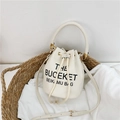 Cream white drawstring bucket bag in pebble leather with adjustable shoulder strap - White