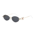 Chic rimless oval sunglasses with diamond-studded gold metal arms and grey lenses - Gold/Gray
