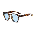 Retro round leopard print sunglasses with blue lenses and silver rivets on white background - Tortoise Frame Blue Lens